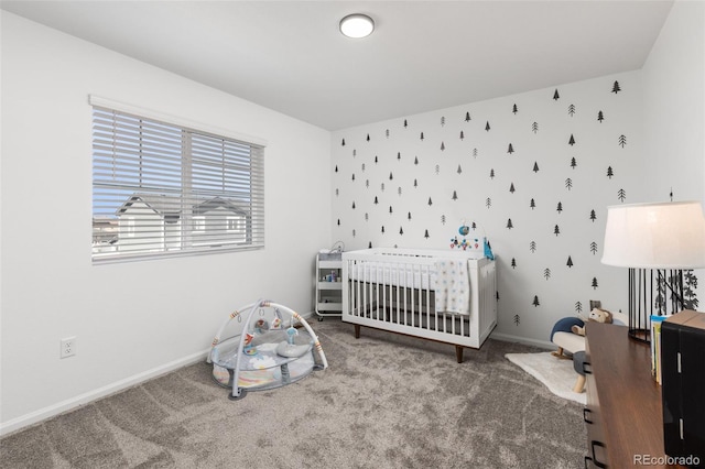 carpeted bedroom with a nursery area, baseboards, and wallpapered walls