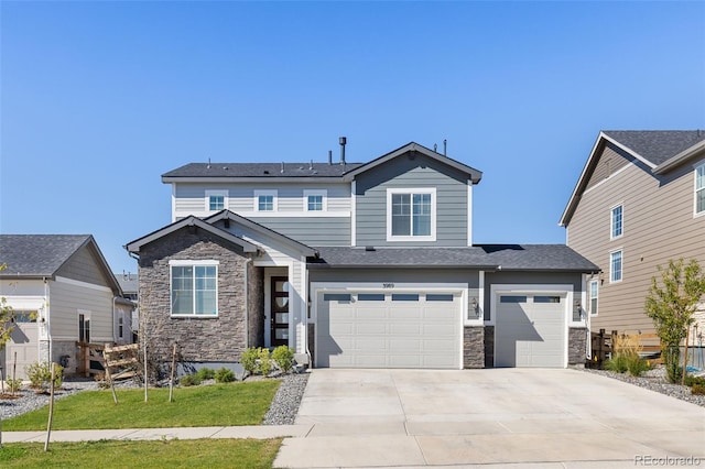 craftsman inspired home with a front yard, stone siding, an attached garage, and concrete driveway