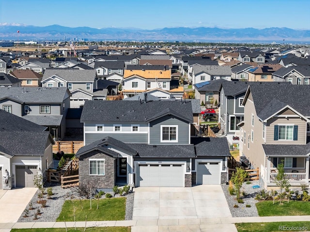 birds eye view of property with a residential view and a mountain view