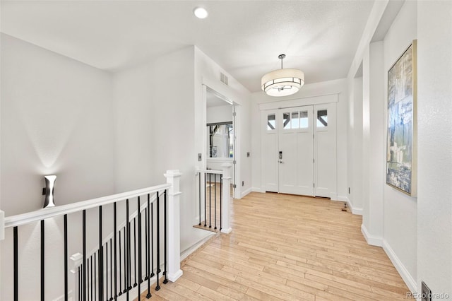 9510 Orion Way, Arvada, CO 80007 - entrance foyer featuring hardwood / wood-style flooring and baseboards