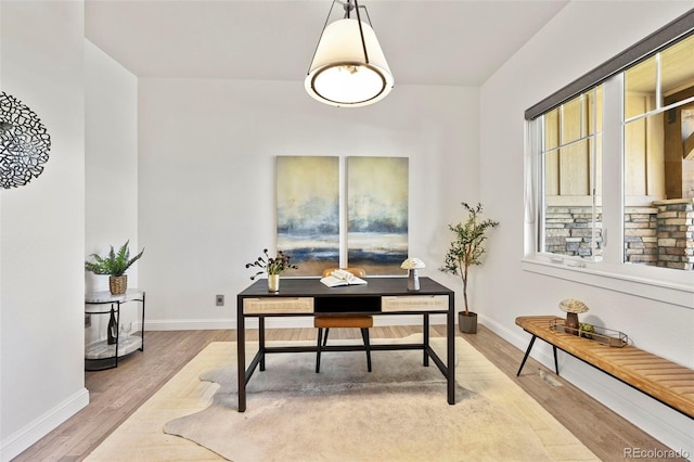 9510 Orion Way, Arvada, CO 80007 - home office featuring baseboards and wood finished floors