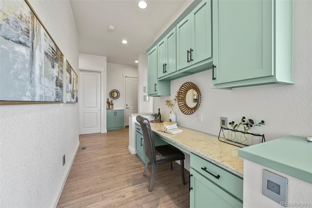 9510 Orion Way, Arvada, CO 80007 - office space featuring light wood-style floors, built in study area, recessed lighting, a textured wall, and baseboards
