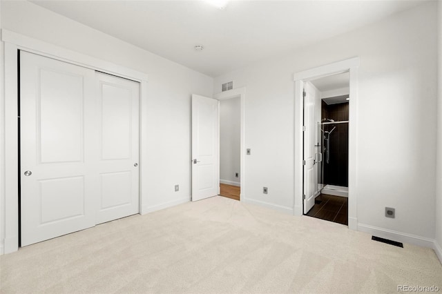 9510 Orion Way, Arvada, CO 80007 - unfurnished bedroom with carpet, baseboards, a closet, and connected bathroom