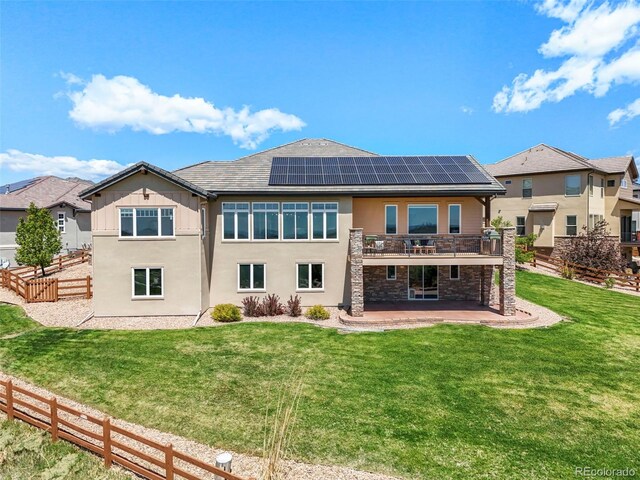 9510 Orion Way, Arvada, CO 80007 - rear view of property with a patio area, a yard, solar panels, a deck, and stucco siding