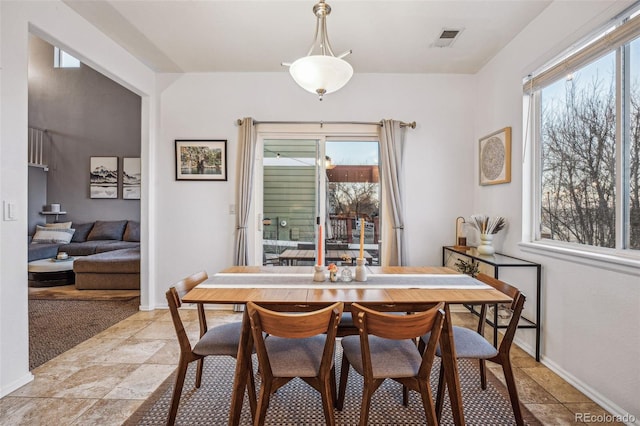 dining room with a healthy amount of sunlight