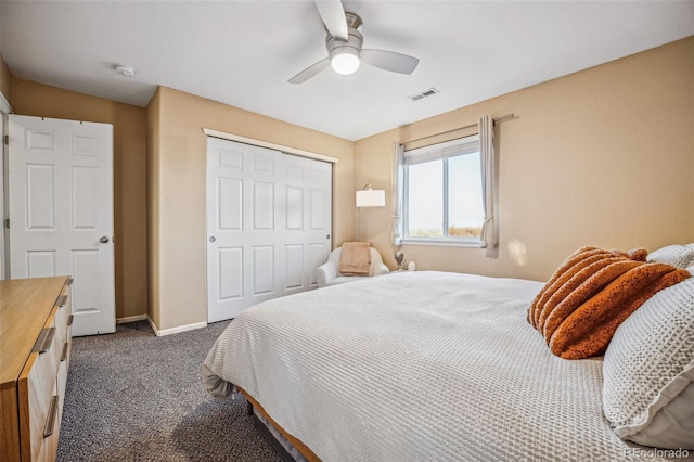 carpeted bedroom featuring ceiling fan and a closet