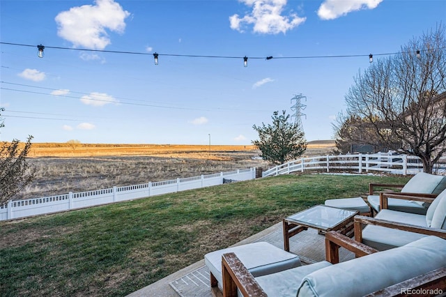 view of yard with a rural view