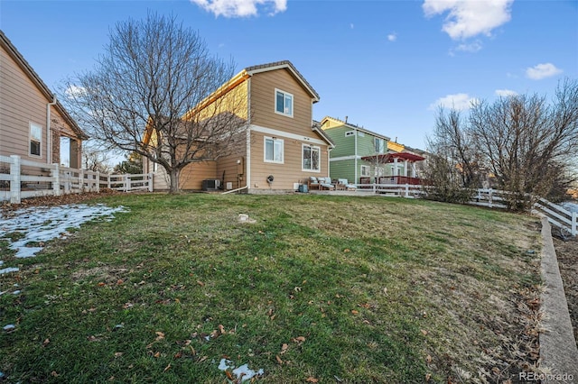 rear view of house with a yard