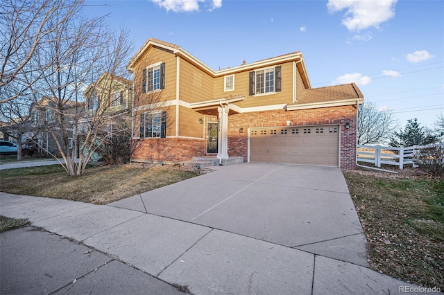 front of property featuring a garage and a front yard