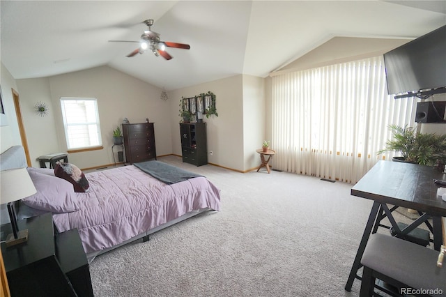 carpeted bedroom with vaulted ceiling, baseboards, and a ceiling fan