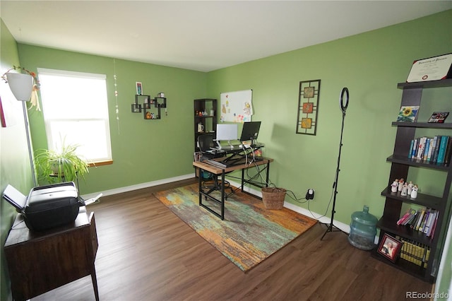 office area with baseboards and wood finished floors