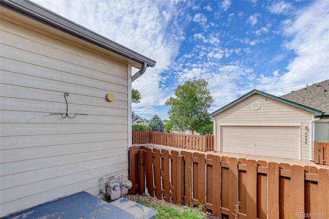 exterior space with an outdoor structure and fence