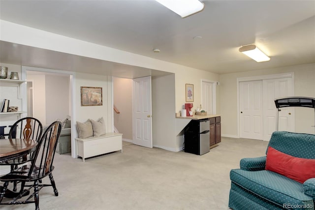 interior space featuring light carpet and baseboards