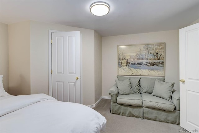 bedroom featuring carpet flooring and baseboards