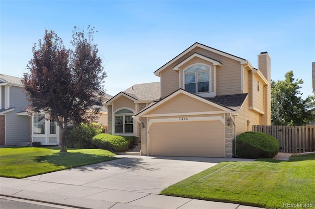 view of property featuring a garage and a front yard