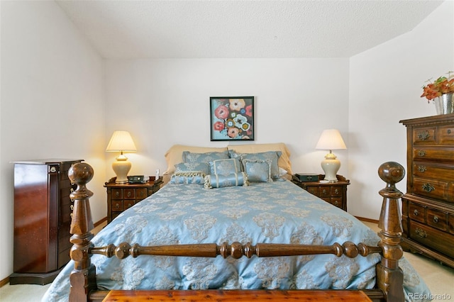 carpeted bedroom with a textured ceiling