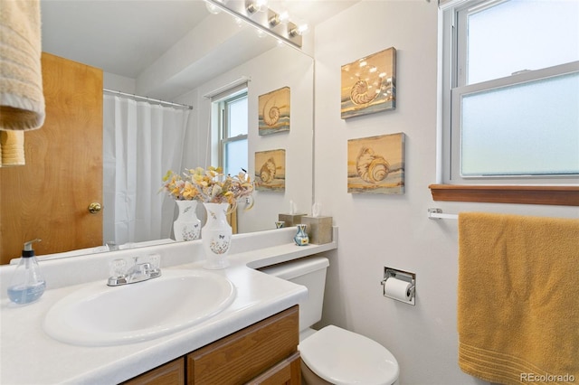 bathroom with vanity and toilet