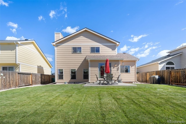 rear view of property featuring a patio area and a lawn