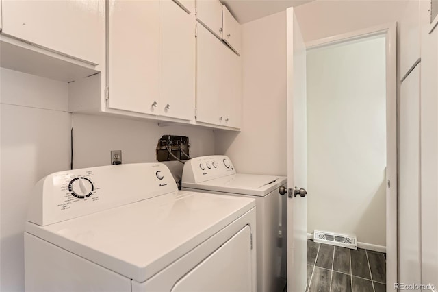 8613 Santa Fe Dr, Thornton, CO 80260 - laundry area with washing machine and dryer, cabinet space, dark wood-style flooring, and baseboards