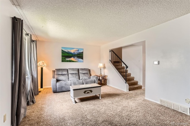 8613 Santa Fe Dr, Thornton, CO 80260 - carpeted living room featuring a textured ceiling and stairs