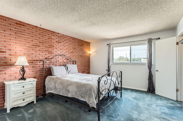 8613 Santa Fe Dr, Thornton, CO 80260 - bedroom featuring dark carpet, brick wall, and a textured ceiling
