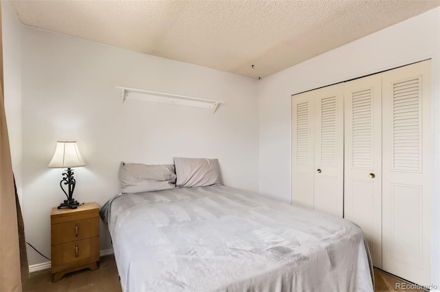 8613 Santa Fe Dr, Thornton, CO 80260 - bedroom with a closet, carpet flooring, and a textured ceiling