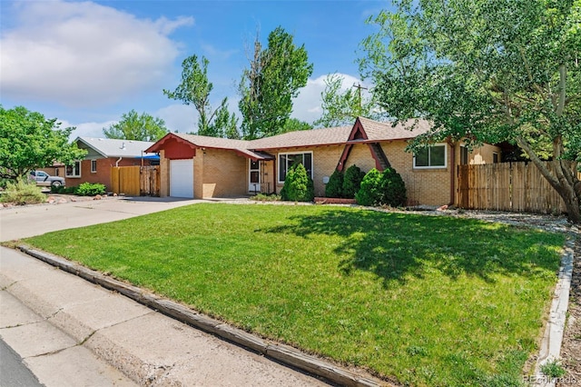 5920 Garrison St, Arvada, CO 80004 - single story home with brick siding, concrete driveway, and a garage