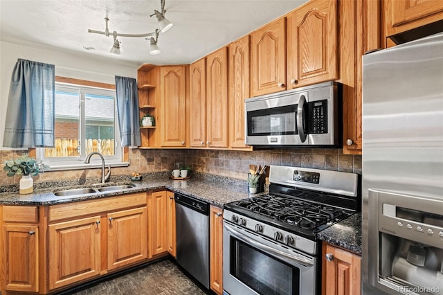 5920 Garrison St, Arvada, CO 80004 - kitchen featuring appliances with stainless steel finishes, a sink, backsplash, dark stone countertops, and open shelves