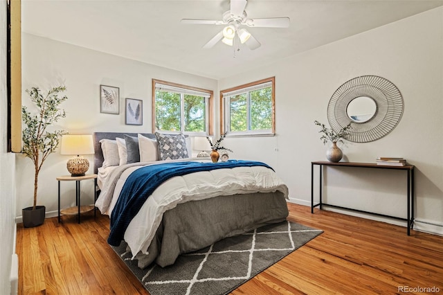 5920 Garrison St, Arvada, CO 80004 - bedroom with wood finished floors, baseboards, and ceiling fan