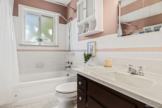 5920 Garrison St, Arvada, CO 80004 - full bathroom featuring shower / tub combo with curtain, toilet, vanity, and tile walls