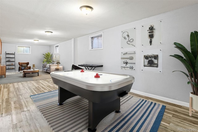 5920 Garrison St, Arvada, CO 80004 - recreation room with wood finished floors and baseboards
