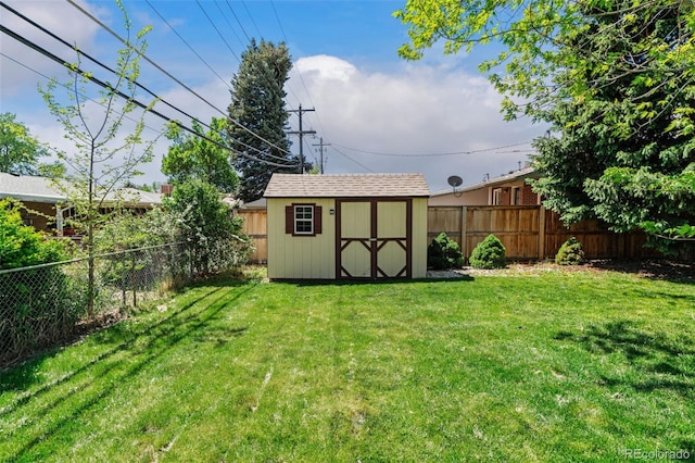 5920 Garrison St, Arvada, CO 80004 - view of yard with a storage shed and an outbuilding