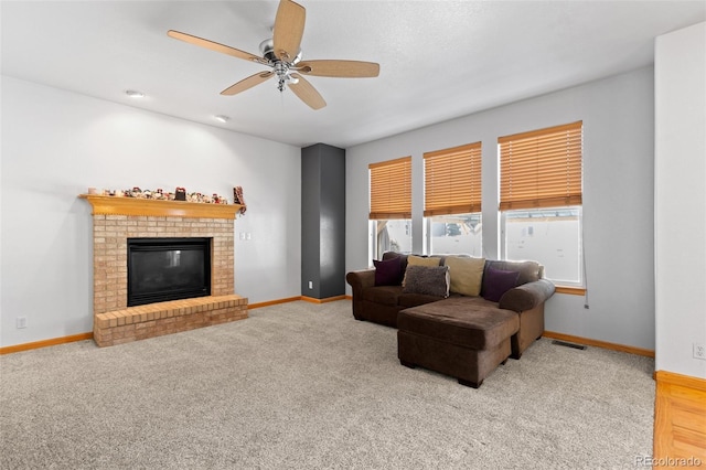 living room featuring a brick fireplace, baseboards, visible vents, and light colored carpet