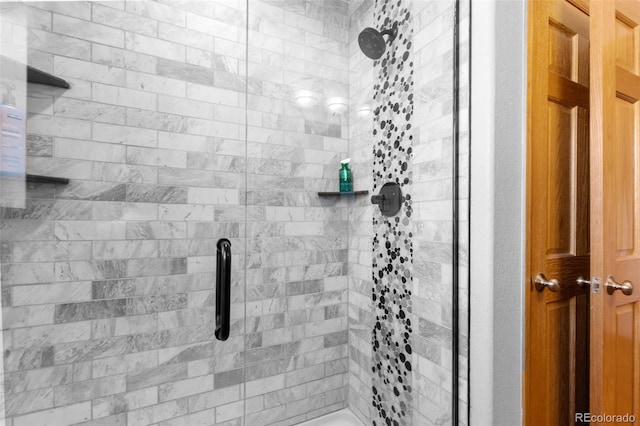 bathroom featuring a shower stall