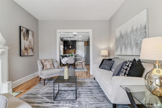 2566 N Emerson St, Denver, CO 80205 - living area featuring wood finished floors and baseboards