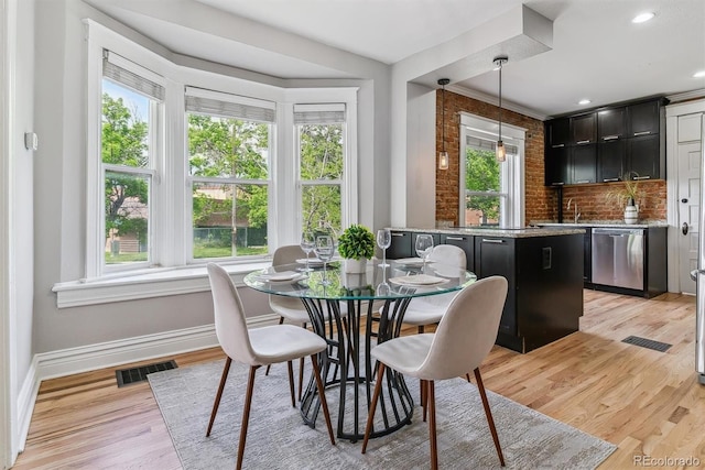 2566 N Emerson St, Denver, CO 80205 - dining room with baseboards, light wood-type flooring, and recessed lighting