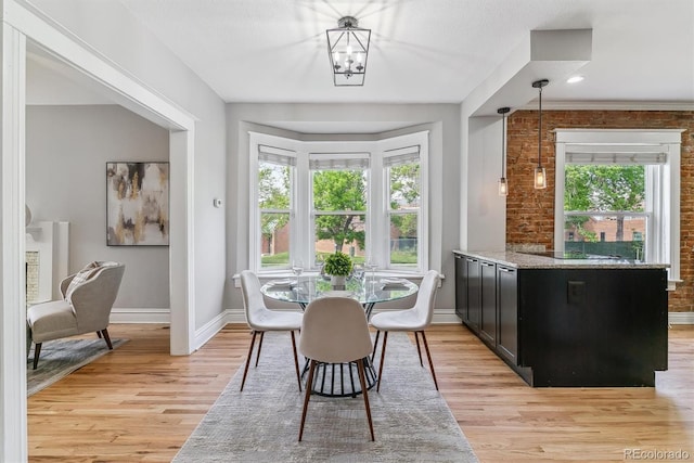 2566 N Emerson St, Denver, CO 80205 - dining area with baseboards and light wood-style flooring