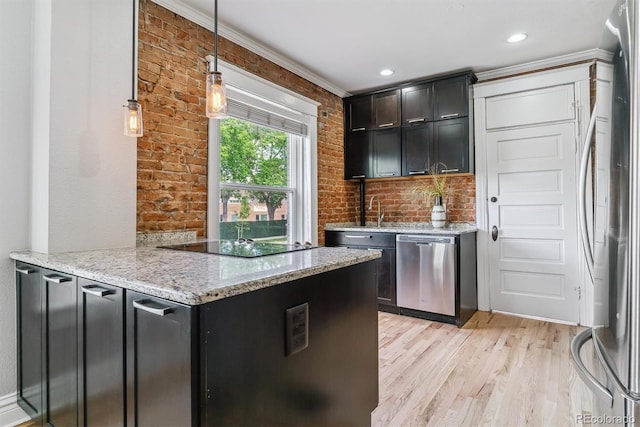 2566 N Emerson St, Denver, CO 80205 - kitchen featuring stainless steel appliances, light wood-type flooring, light stone counters, decorative light fixtures, and crown molding