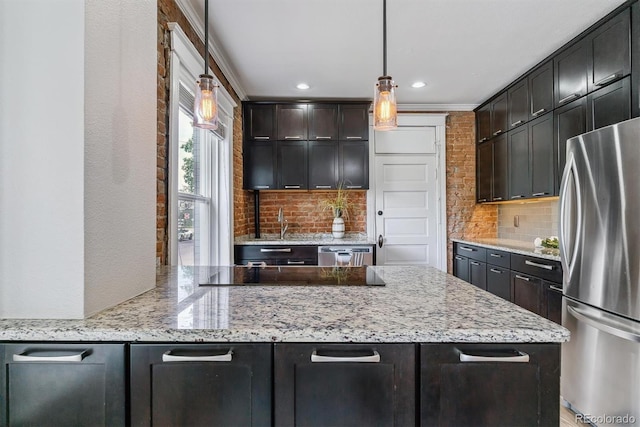 2566 N Emerson St, Denver, CO 80205 - kitchen featuring stainless steel appliances, tasteful backsplash, light stone countertops, hanging light fixtures, and recessed lighting
