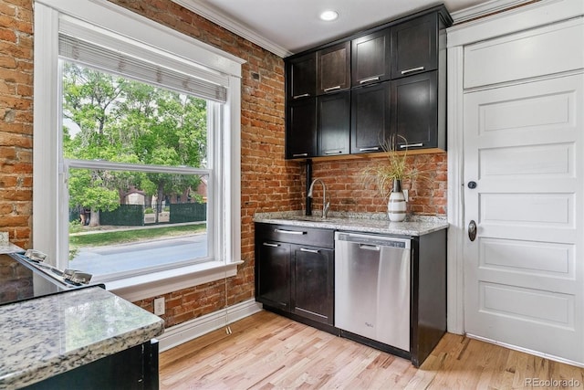2566 N Emerson St, Denver, CO 80205 - bar area featuring brick wall, stainless steel dishwasher, light wood-style flooring, baseboards, and a sink