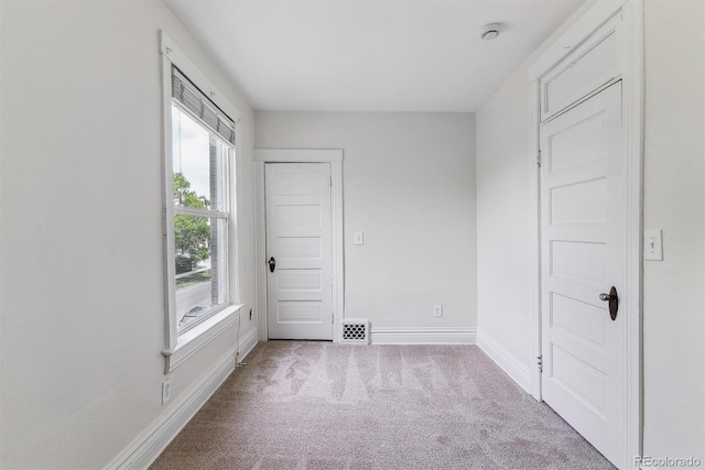 2566 N Emerson St, Denver, CO 80205 - carpeted empty room featuring baseboards and a smoke detector