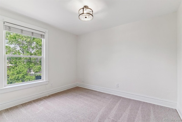 2566 N Emerson St, Denver, CO 80205 - carpeted spare room with baseboards