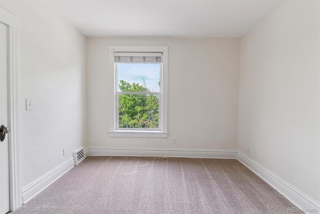 2566 N Emerson St, Denver, CO 80205 - empty room with carpet flooring and baseboards