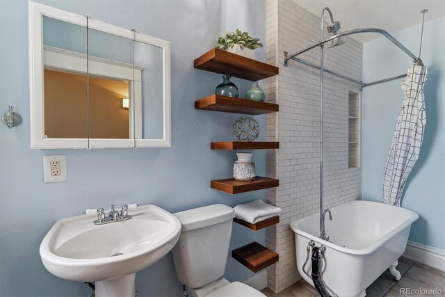 2566 N Emerson St, Denver, CO 80205 - bathroom featuring a sink, a soaking tub, toilet, and a shower with curtain