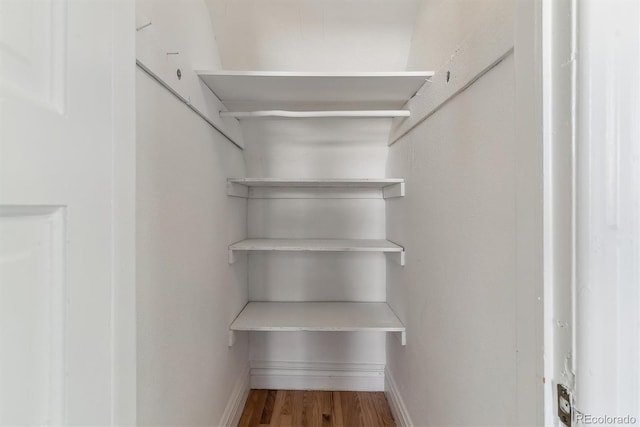 2566 N Emerson St, Denver, CO 80205 - walk in closet featuring wood finished floors