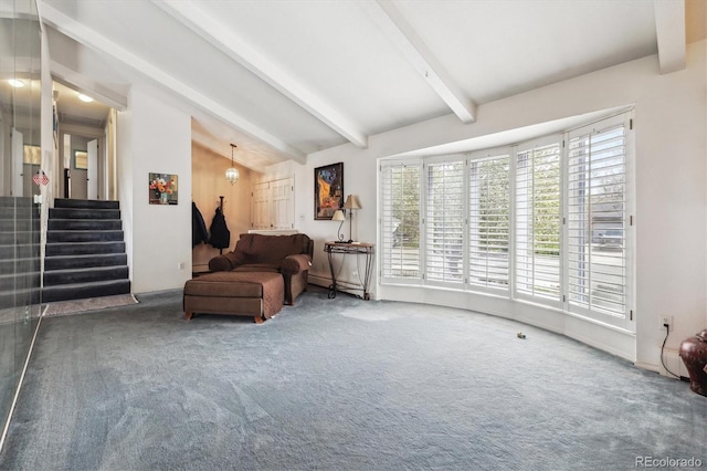 carpeted living area featuring plenty of natural light, stairs, and a baseboard heating unit