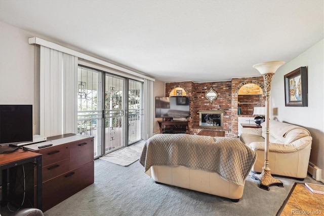 carpeted living area with a fireplace and a baseboard radiator
