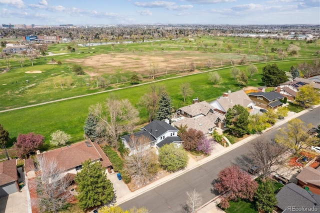 aerial view of residential area with a large body of water and a golf club