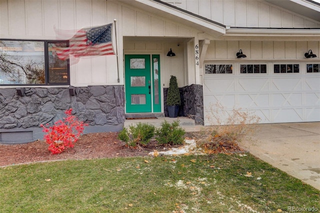 view of exterior entry with a garage