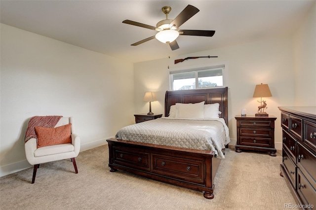 bedroom with ceiling fan and light carpet